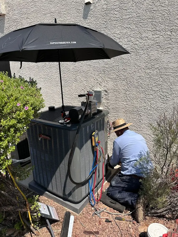 HVAC technician performing outdoor AC maintenance in Seabrook